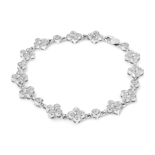 White metal bracelet with round white gemstones in floral and circular settings, shot from a slightly elevated angle on a white background.