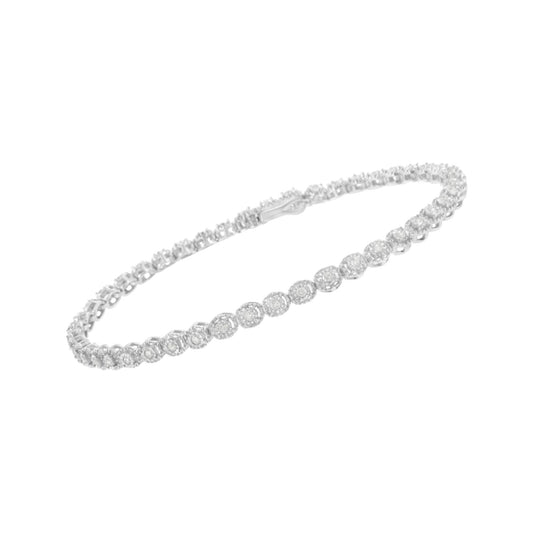 White metal bracelet with round shaped white gemstones in miracle setting, shown at an angle.