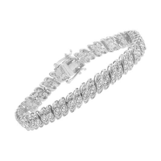 White metal bracelet with linked sections, each set with multiple white round gemstones in prong settings, shown at an angled top-down view.