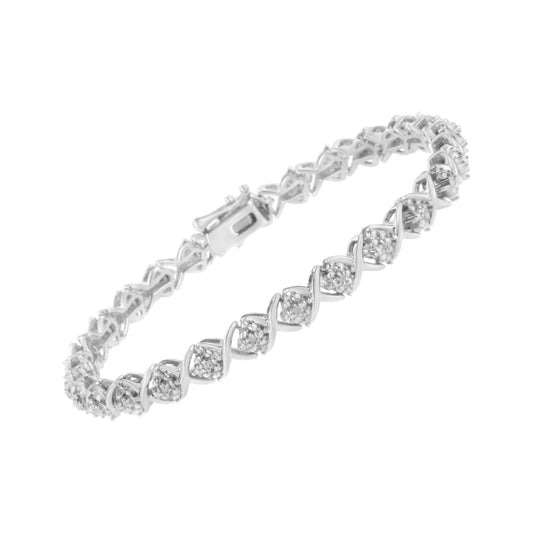 White metal bracelet with round white gemstones in a pave setting, shown at an angled close-up view.
