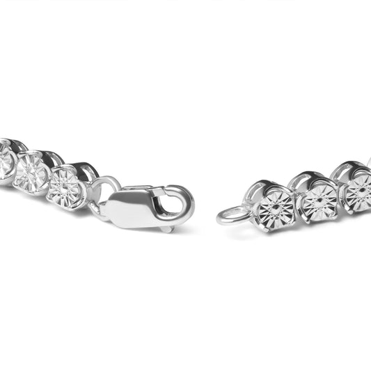 Close-up angled view of a white metal bracelet with round white gemstones in miracle settings, showing the clasp open on a white background.