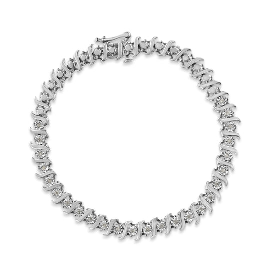 Top-down view of a white metal bracelet with round white gemstones in a miracle setting along the entire piece.