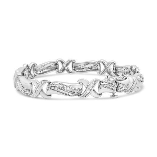 White metal bracelet with alternating curved and X-shaped links, featuring round and baguette-shaped white gemstones in prong and channel settings, shown in a front-facing angled view.
