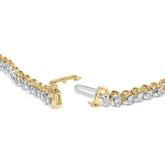Close-up front angle of a yellow bracelet with round white gemstones in prong settings, showing the open clasp.