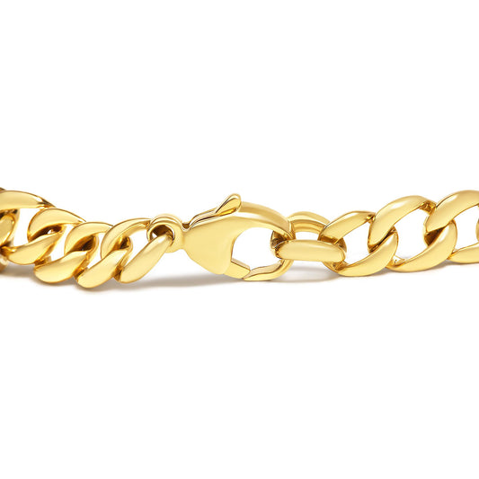 Close-up side angle of a yellow metal chain bracelet with a lobster clasp, no gemstones visible.