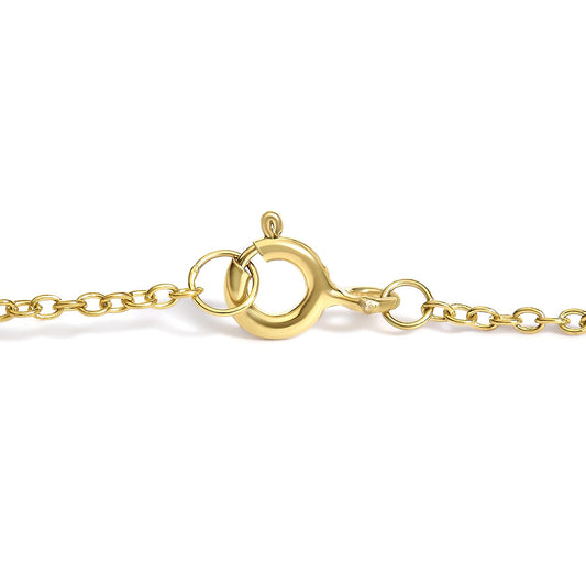 Close-up front angle of a yellow metal bracelet clasp with small white gemstones on the clasp, showing the chain links on either side.
