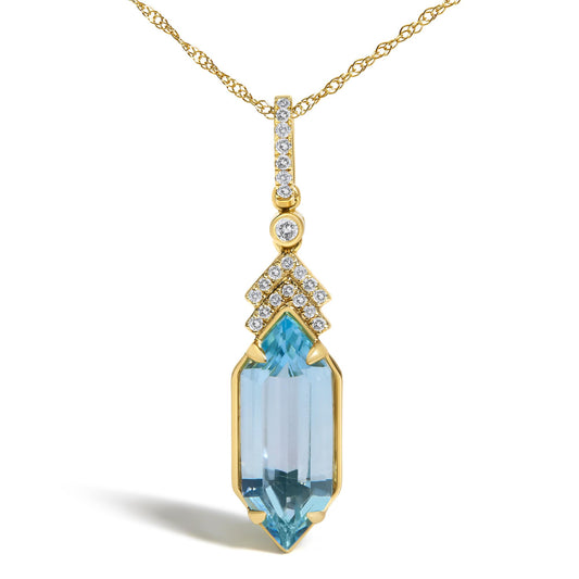 Close-up front view of a yellow metal necklace with a vertical pendant featuring small round white gemstones in micro-pave setting, a round white gemstone in a bezel setting, and a blue gemstone with a prong setting at the bottom.