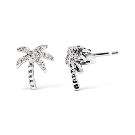 Front and side view of white metal palm tree-shaped earrings with round white gemstones in pave setting.