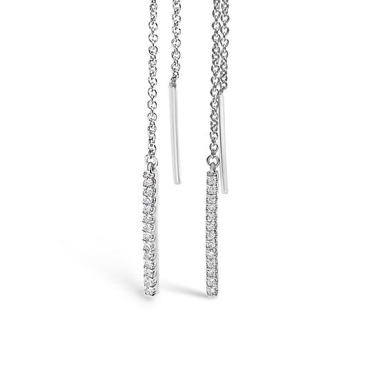 Front angle view of a pair of white metal threader earrings, each featuring a slim vertical bar adorned with small white gemstones in a micro-pave setting, hanging from delicate chains.