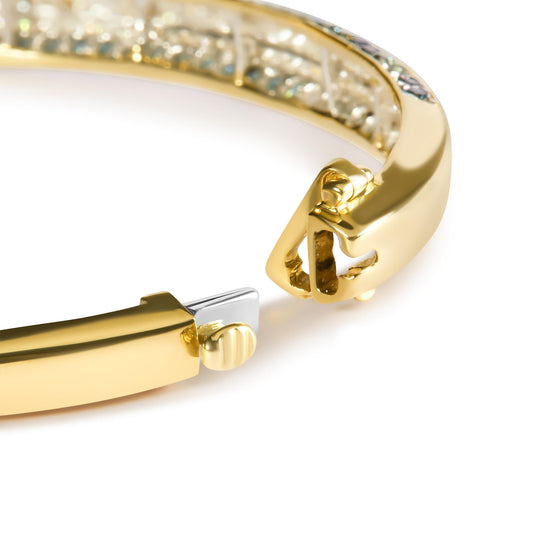 Close-up angle of a yellow bracelet showcasing the clasp and a row of white princess-shaped gemstones set in a channel, accented by small blue round gemstones in a pave setting along the band.