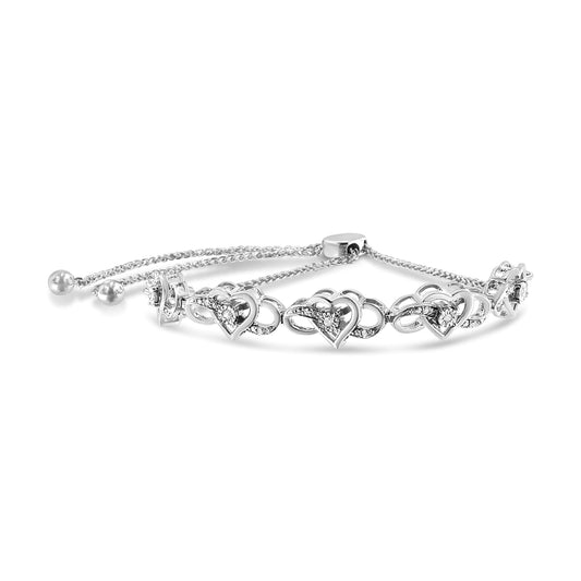 White metal bracelet with heart-shaped links featuring white round gemstones in miracle setting, shown from a front angle.