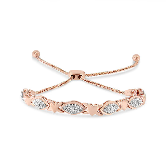 Close-up front view of a rose-colored bracelet with alternating heart shapes and clusters of round white gemstones in pave setting, featuring an adjustable sliding clasp.