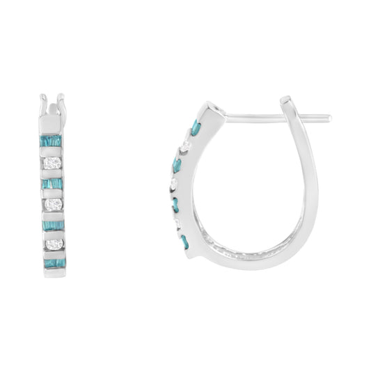 White metal hoop earrings with channel-set white round gemstones and blue baguette gemstones, shown from front and side angles.