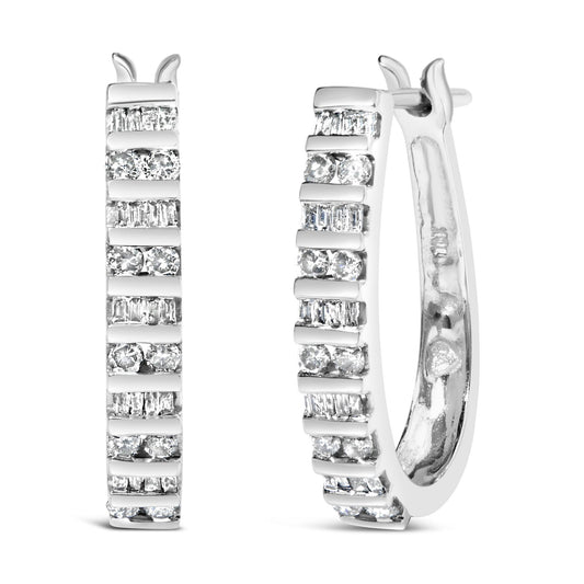 Pair of white metal hoop earrings shown front and side on a white background, featuring alternating rows of round and baguette-shaped white gemstones in channel settings.