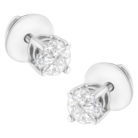 Pair of white metal stud earrings with round white gemstones in prong settings, shown at a slight angle.