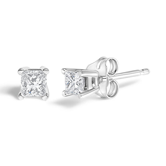Pair of white metal stud earrings with princess-shaped white gemstones in prong settings, shown from front and side angles.