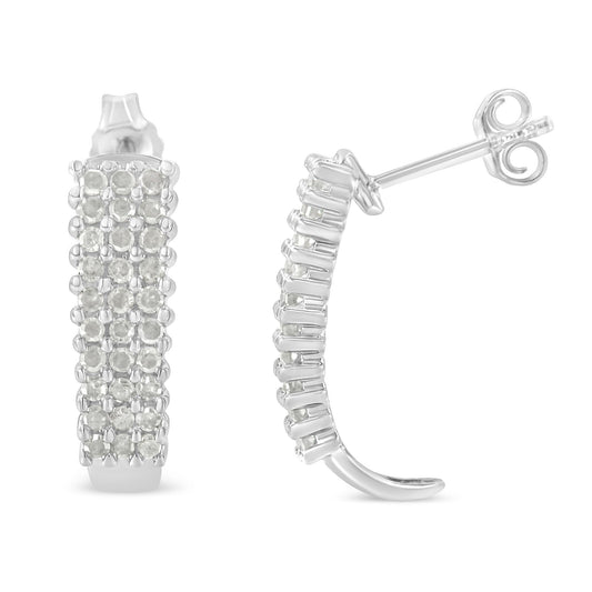 Pair of white metal semi-hoop earrings with multiple rows of round white gemstones in prong settings, shown from front and side angles.