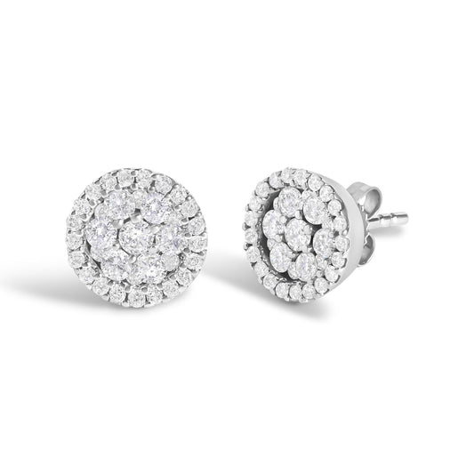 Pair of white metal round stud earrings with multiple small white gemstones in tension and shared prong settings, front and side view on a white background.