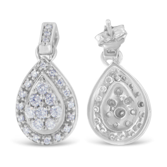Front and back views of white metal teardrop-shaped earrings with round white gemstones in prong settings.