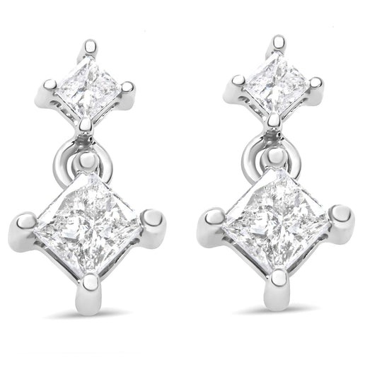 Pair of white metal earrings with two prong-set princess-shaped white gemstones each, shown in a front angle.