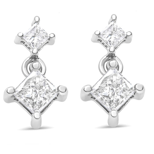 Front view of a pair of white metal earrings each featuring two princess-shaped white gemstones in prong settings.