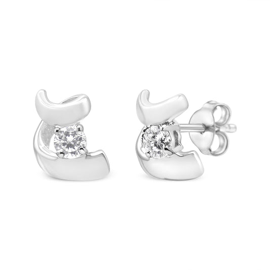 Front and side angled view of white metal earrings with round white gemstones in prong settings.