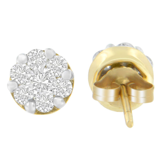 Pair of yellow metal stud earrings with round white gemstones in prong settings, shown from front and back angles.