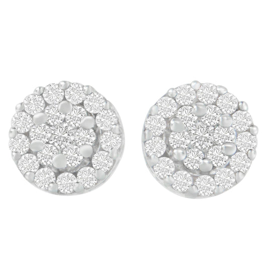Front view of round white metal stud earrings with multiple small round white gemstones in prong settings.