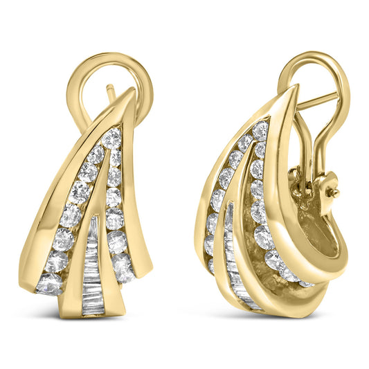 Close-up shot of a pair of yellow metal earrings with overlapping curved shapes, featuring channel-set white round and baguette gemstones, displayed against a white background.