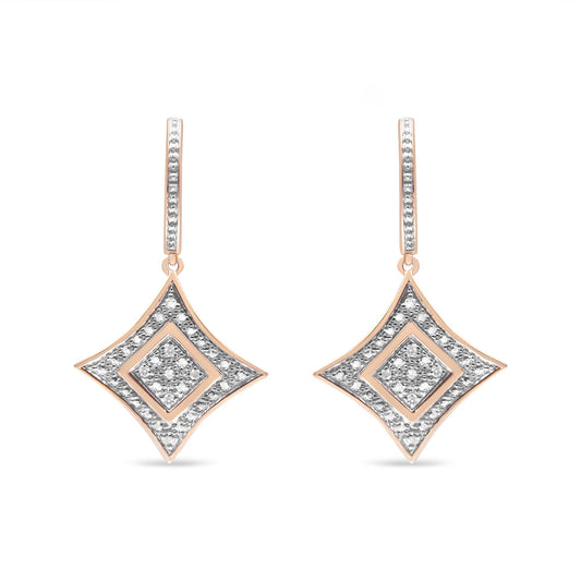 Front view of a pair of rose metal drop earrings with diamond-shaped pendants adorned with white gemstones in pave setting.