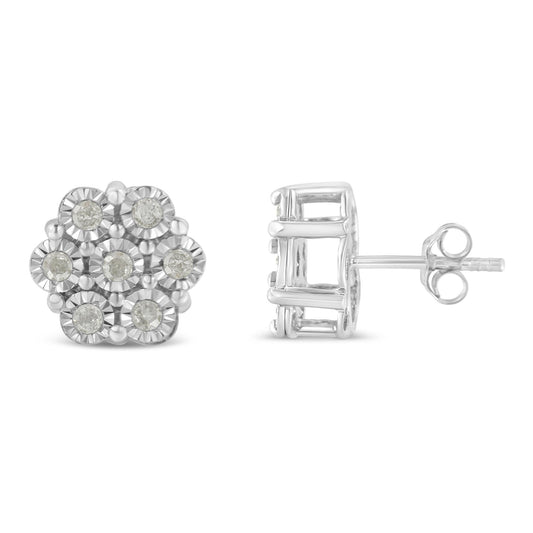 Pair of white metal stud earrings with round white gemstones in a floral cluster design, shown from front and side angles.