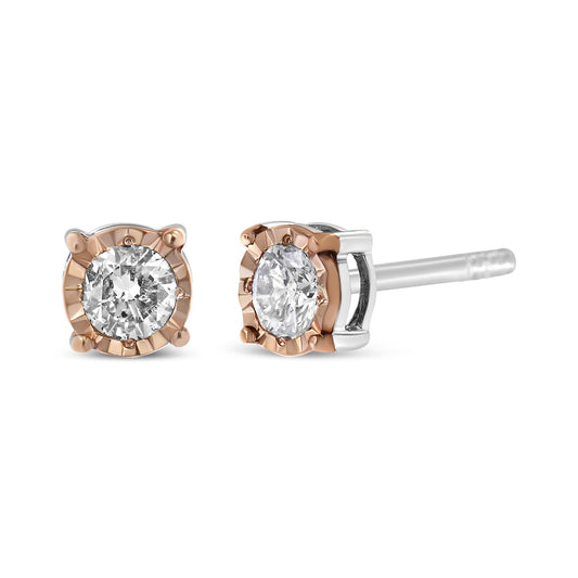 Close-up front and side view of two-toned stud earrings with round white gemstones in a miracle setting.