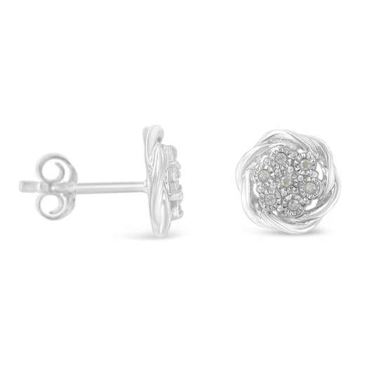 Pair of white metal stud earrings with round white gemstones in a floral cluster pattern, shown from front and side angles.
