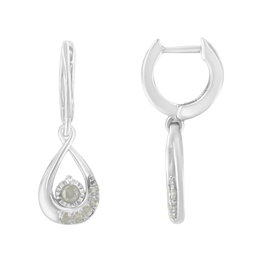 Front and side view of white metal drop earrings with an open teardrop design and round white gemstones in pave setting.