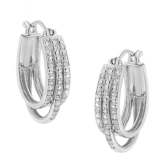 Pair of white metal hoop earrings with three overlapping bands, each set with round white gemstones in a pavé setting, shown at a slight angle.