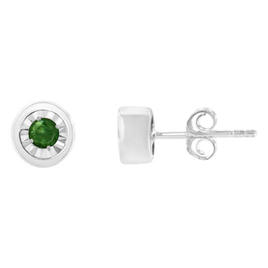 Front and side view of white metal stud earrings with round green gemstones in miracle setting.