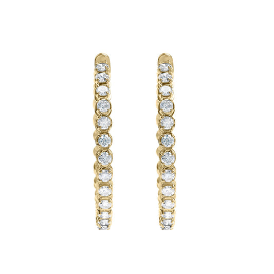Pair of yellow metal hoop earrings with round white gemstones in prong settings, shown from the front angle on a white background.