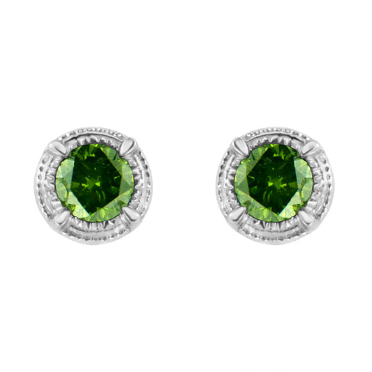 Front view of white metal stud earrings with round green gemstones in prong settings.