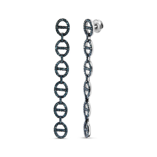 Close-up front and side view of white metal drop earrings featuring linked oval shapes encrusted with round blue gemstones in prong settings.