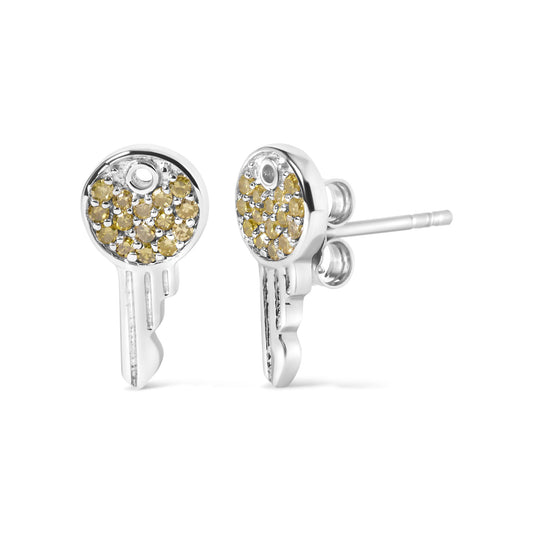 Close-up front and side angle of white metal key-shaped stud earrings with round yellow gemstones in a prong setting.