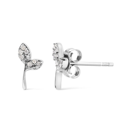 Close-up front and side view of a pair of white metal earrings shaped like two leaves, each leaf accented with multiple round white gemstones in prong settings, shown on a white background.