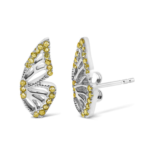 Close-up front and side angle of white metal earrings shaped like stylized leaves, adorned with round yellow gemstones in prong settings.