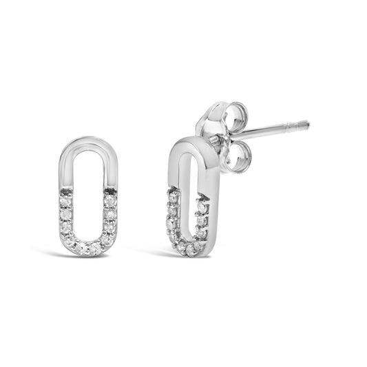 White metal oval-shaped earrings with round white gemstones in prong settings on the lower half, shown from front and side angles on a white background.