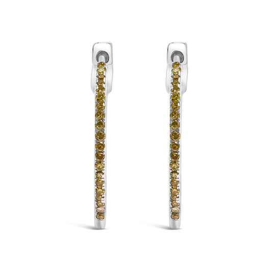 Front view of white metal hoop earrings set with round yellow gemstones in prong settings.