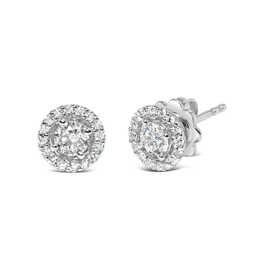 Pair of white metal stud earrings with round white gemstones in prong settings, shown in a front and angled side view on a white background.