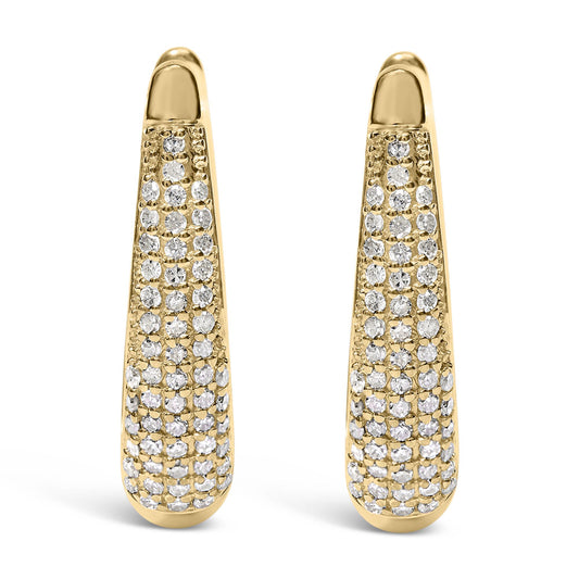 Front-facing view of a pair of yellow metal earrings with pave-set round white gemstones covering the lower length of each earring.