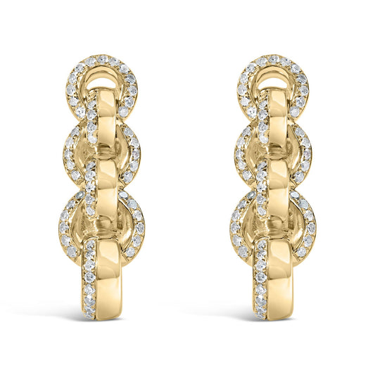 Front view of a pair of yellow metal chain link earrings adorned with round white gemstones in prong settings.