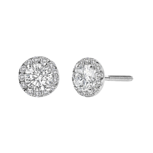 Front and side angled view of a pair of white metal stud earrings with a large round white gemstone center surrounded by smaller round white gemstones in prong settings.