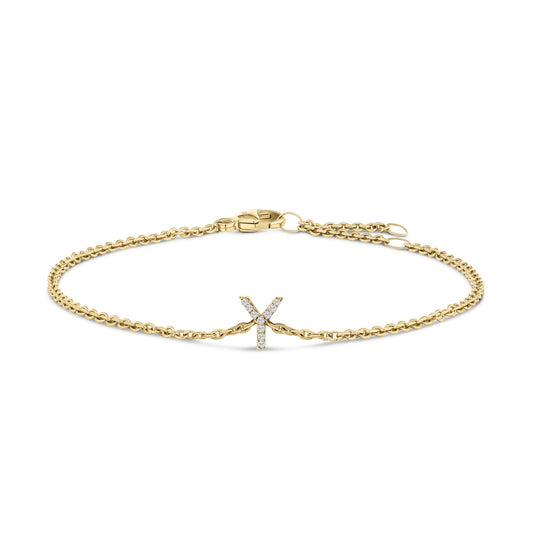 Yellow metal bracelet with a central letter 'Y' adorned with white round gemstones in a micro-pave setting, shown flat on a white background from a top angle.