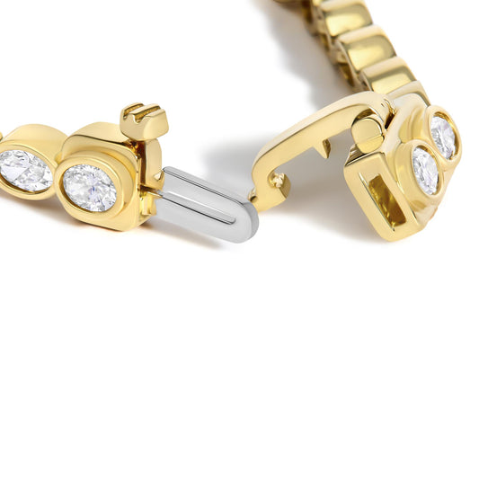 Close-up of 14K yellow gold 3 3/4 Cttw oval diamond east west bezel set tennis bracelet clasp on white background